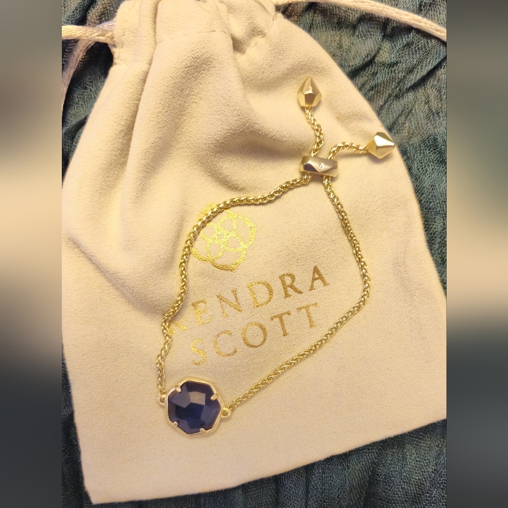 Kendra Scott adjustable bracelet. Soft gold colored chain w/blue stone